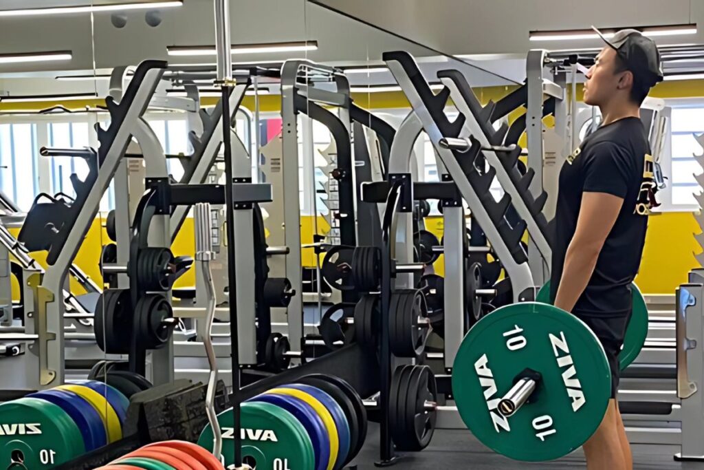 Man lighting a barbell with weights